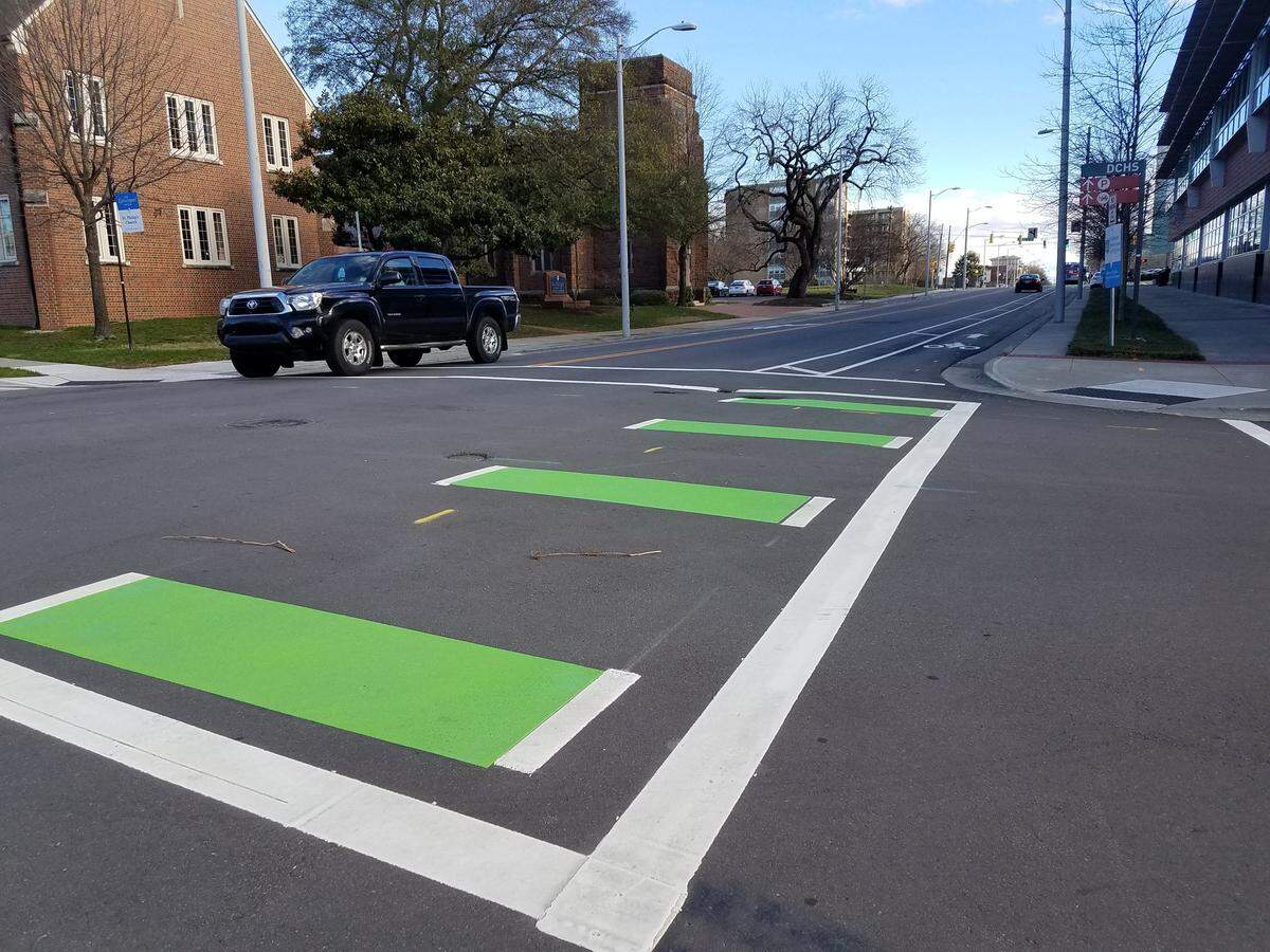 Called a “bike box,” the rectangles of green paint at East Main Street intersections are there to create space for bicycles to cross ahead of vehicle traffic.