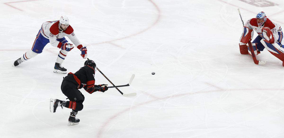 Carolina's Nikolaj Ehlers (27) makes the winning shot in overtime of the Hurricanes’ 3-2 overtime victory over the Canadiens in game two of the Eastern Conference Finals at the Lenovo Center in Raleigh, N.C., Saturday, May 23, 2026.