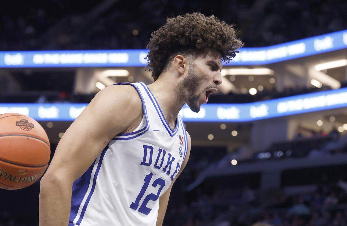 Duke’s Cameron Boozer (12) celebrates after slamming in two in the second half of Duke’s 75-60 victory over Texas in the Dick Vitale Invitational at the Spectrum Center in Charlotte, N.C., Tuesday, Nov. 4, 2025.