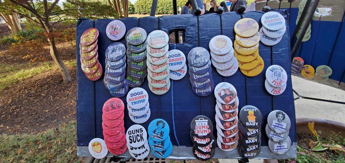 Buttons are sold outside an Elizabeth Warren campaign rally at Broughton High School in Raleigh on Thursday, Nov. 7, 2019.