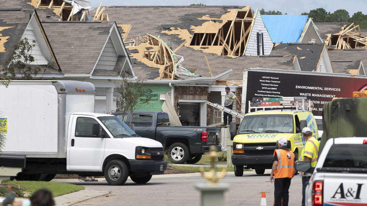 An army of home repair specialists work to repair 40 homes in a Carolina Shores, N.C. subdivision that were damaged by a tornado spawned by Hurricane Dorian on Sept. 5, 2019.