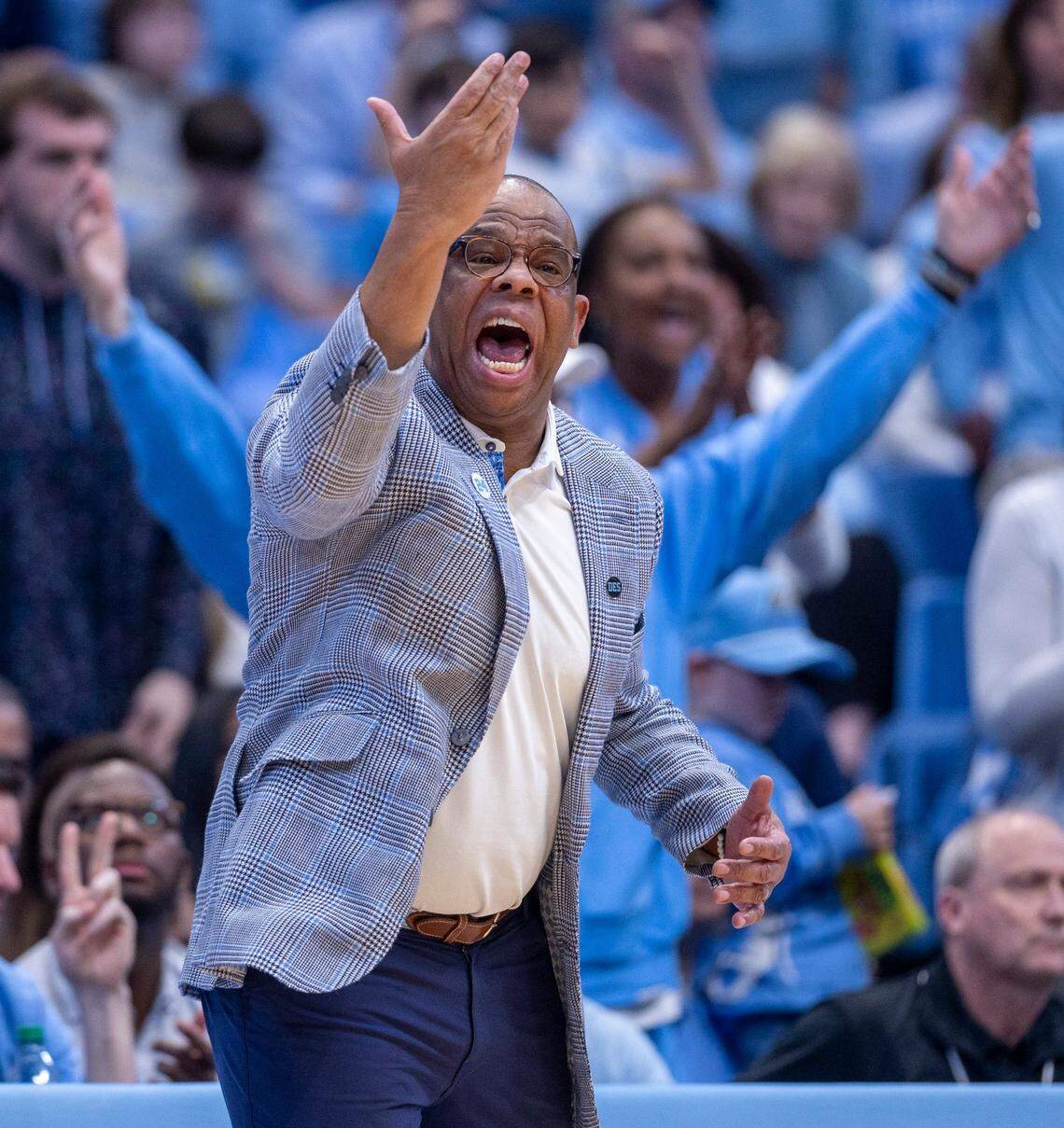 North Carolina coach Hubert Davis directs his team on offense during the first half against Duke on Saturday, February, 3, 2024 at the Dean E. Smith Center in Chapel Hill, NC.