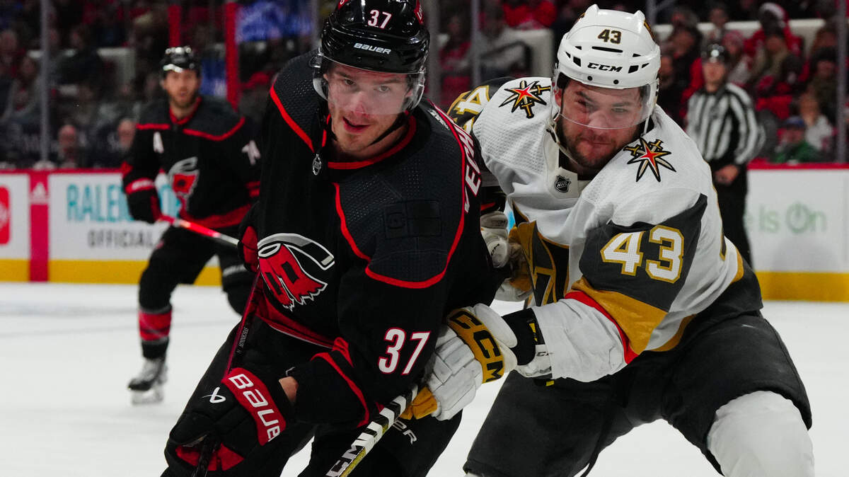 Dec 19, 2023; Raleigh, North Carolina, USA; Carolina Hurricanes right wing Andrei Svechnikov (37) and Vegas Golden Knights center Paul Cotter (43) battle for position during the first period at PNC Arena. Mandatory Credit: James Guillory-USA TODAY Sports
