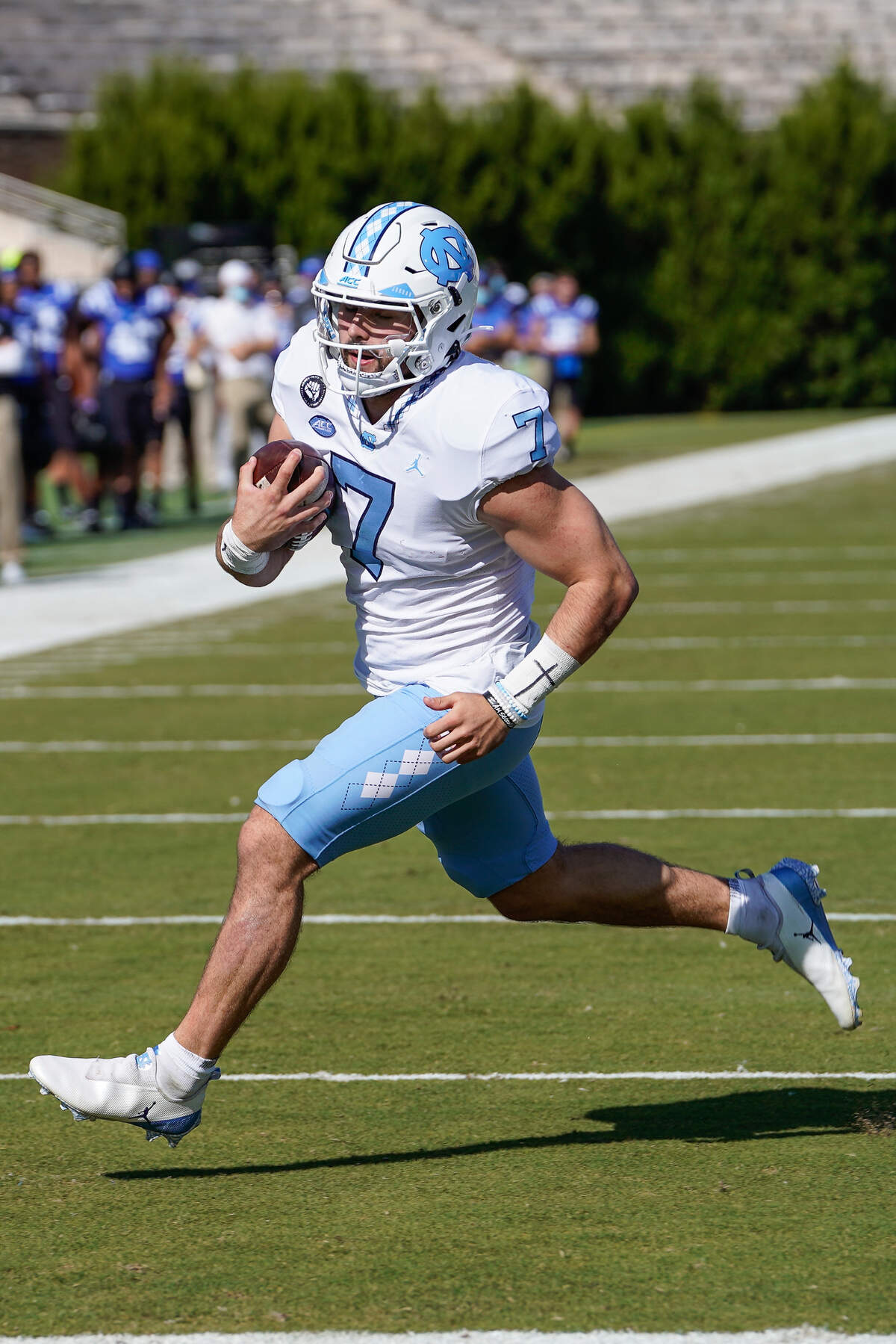 North Carolina Tar Heels quarterback Sam Howell (7) scores a touchdown against the Duke Blue Devils during the first quarter at Wallace Wade Stadium.