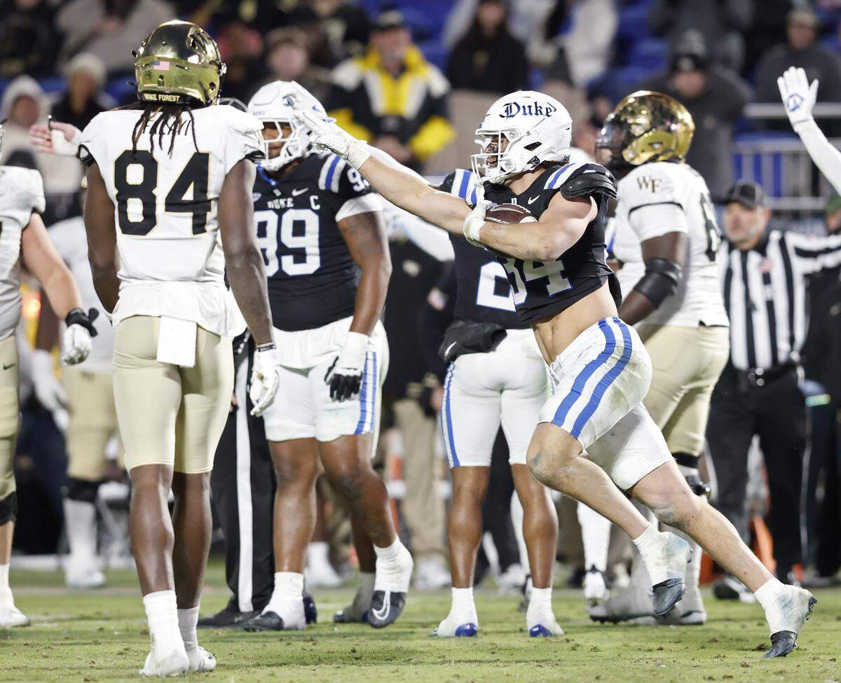 Duke linebacker Luke Mergott reacts after recovering a fumble during the second half of the Blue Devils’ 49-32 win over Wake Forest on Saturday, Nov. 29, 2025, at Wallace Wade Stadium in Durham, N.C.