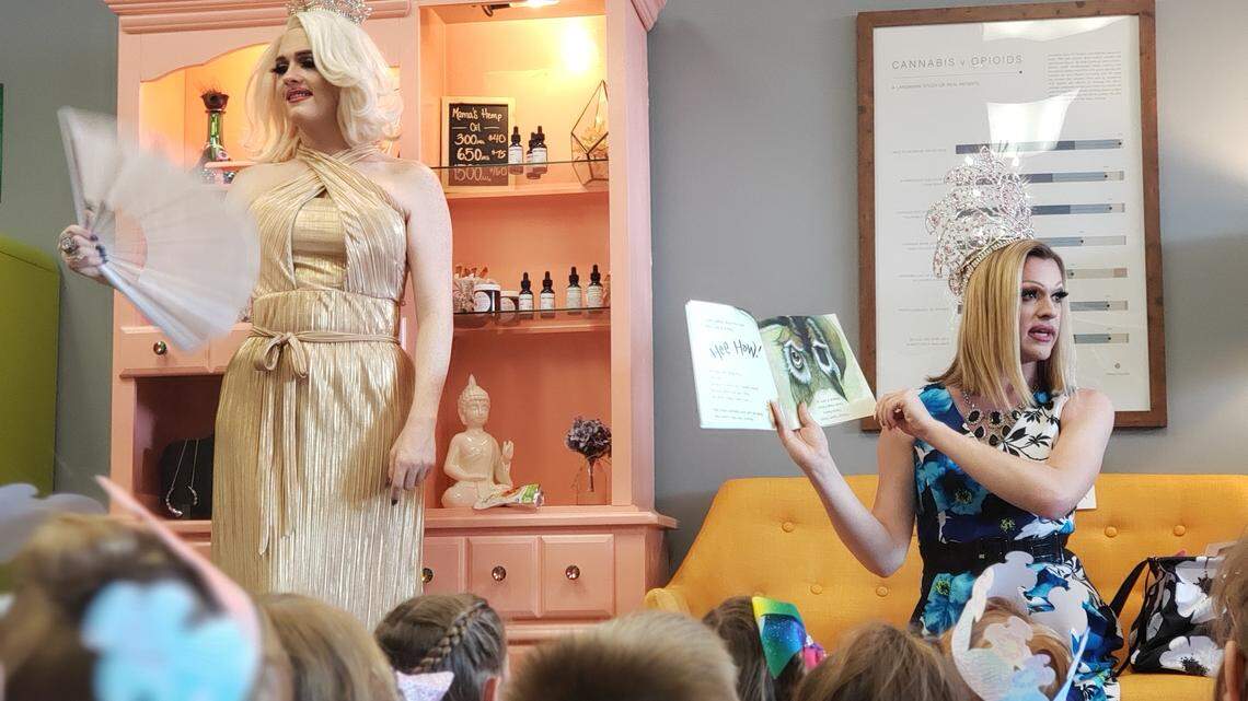 Amazing Grace, left, and Satine Allure read books to children Saturday June 29, 2019, as part of what appears to be Raleigh’s first Drag Queen Story Hour. The event was held at Medicine Mama’s Farmacy in Raleigh.