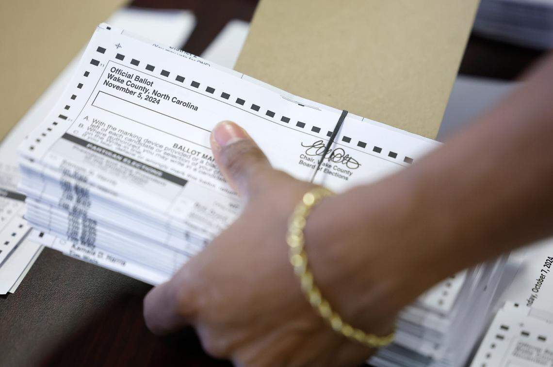 Absentee ballots are prepared to be sent out at the Wake County Board of Elections Operations Center in Raleigh, N.C., Tuesday, Oct. 8, 2024.