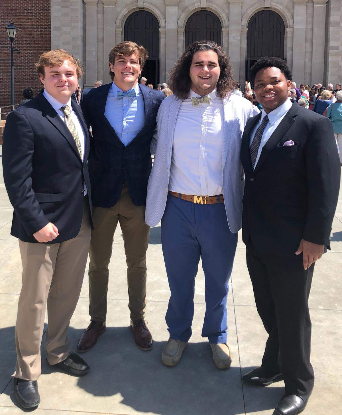 From left, Cardinal Gibbons High School football players Tim Charnot, Ethan Grace, Joey Olivieri and Jonathan Ward were among the school’s delegation to the Diocese of Raleigh Chrism Mass, held Tuesday, April 12, at Holy Name of Jesus Cathedral in Raleigh.
