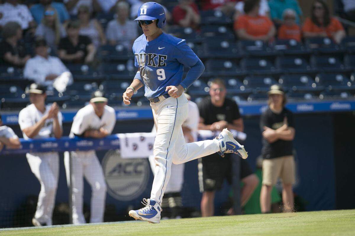 Duke’s Griffin Conine (9) scores after a walk by Wake Forest pitcher Antonio Melendez to give the Blue Devils’ a 3-2 lead in the 13th inning during the ACC Championship on Thursday, May 24, 2018, at Durham Bulls Athletic Park in Durham, N.C