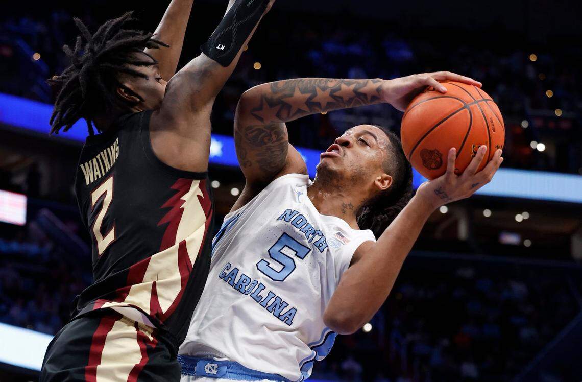 North Carolina’s Armando Bacot (5) shoots as Florida State’s Jamir Watkins (2) defends during the first half of UNC’s game against Florida State in the quarterfinal round of the 2024 ACC Men’s Basketball Tournament at Capital One Arena in Washington, D.C., Thursday, March 14, 2024.