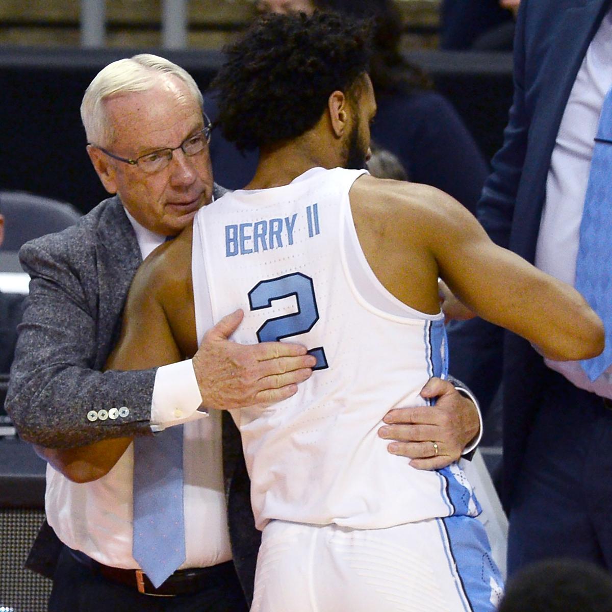 UNC Tar Heels head coach Roy Williams, left, embraces guard Joel Berry II, right, as he walks to the team's in the closing seconds of action against Texas A&M during second round action in the NCAA Division I Men's Basketball Tournament at the Spectrum Center in Charlotte, NC on Sunday, March 18, 2018. Texas A&M defeated UNC 86-65.