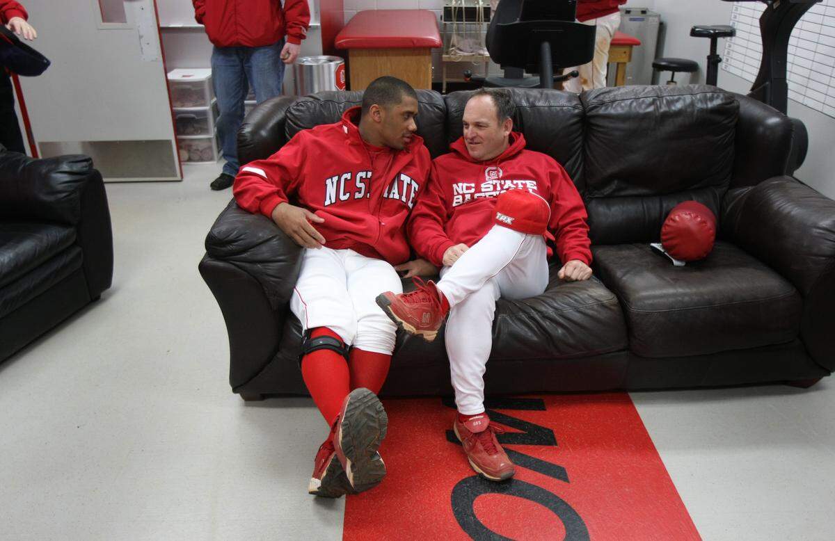 N.C. State's Russell Wilson talks with head coach Elliott Avent after practice Tuesday Feb. 17, 2009, at Doak Field.  