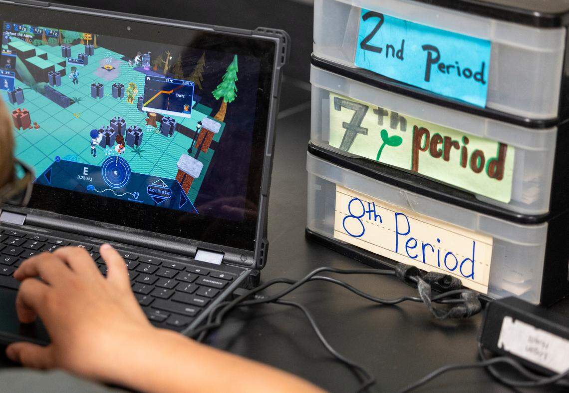 A Wake County middle school student plays Plasma Games’ ”SciOps: Global Defense” video game during science class.