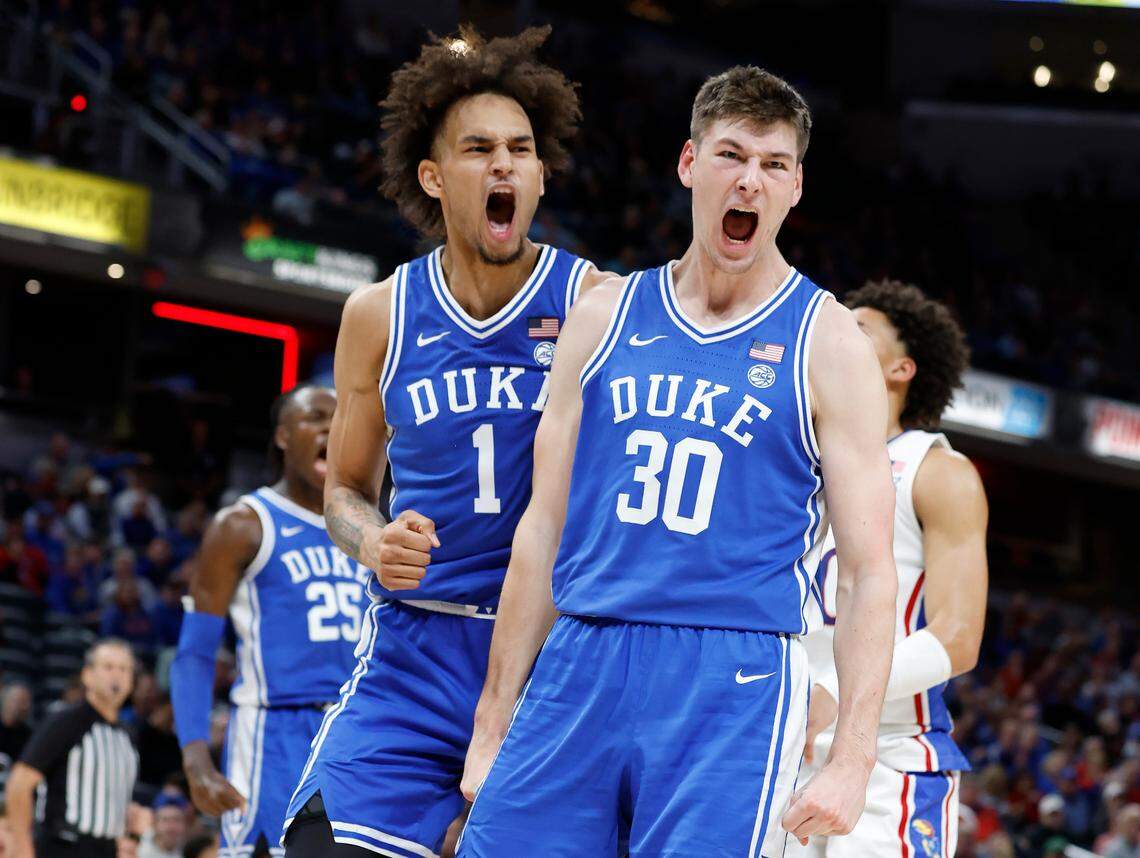 Duke’s Dereck Lively II (1) and Kyle Filipowski (30) react after Filipowski slammed in two during the second half of Kansas’ 69-64 victory over Duke in the State Farm Champions Classic in Indianapolis, Ind. Tuesday, Nov. 15, 2022.