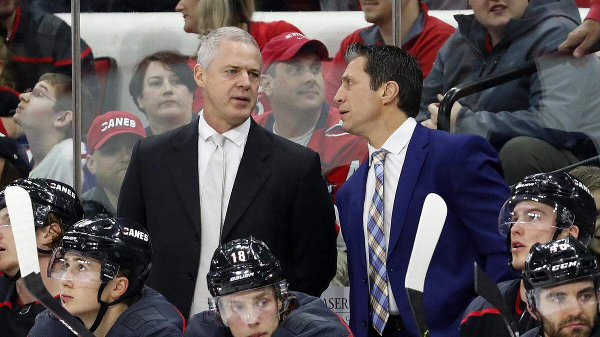 Carolina Hurricanes head coach Rod Brind ‘Amour speaks with assistant coach Jeff Daniels during the third period of an NHL hockey game against the Washington Capitals in Raleigh, N.C., Friday, Jan. 3, 2020. (AP Photo/Karl B DeBlaker)