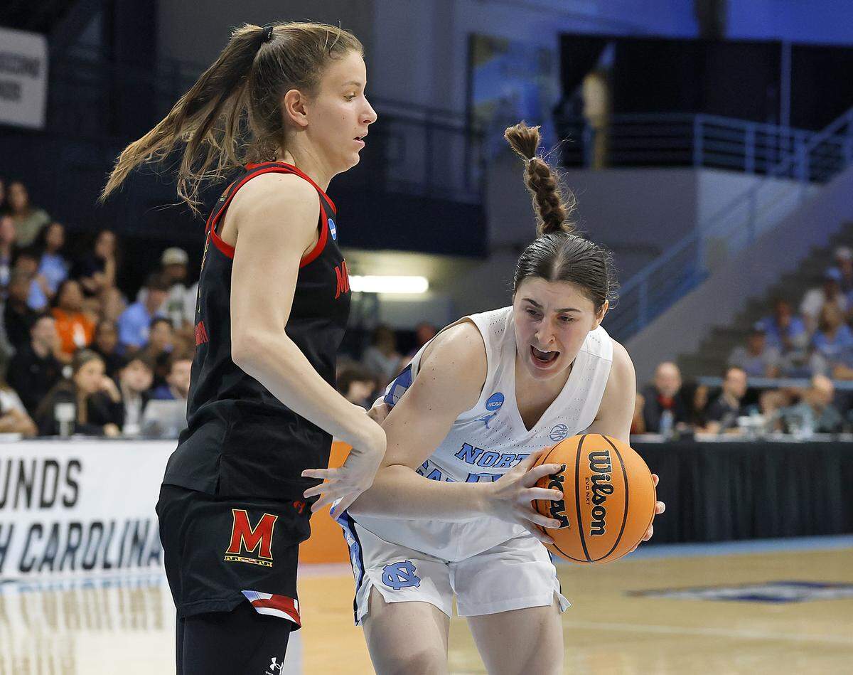 North Carolina’s Lanie Grant drives past Maryland’s Yarden Garzon during the second half of the Tar Heels’ 74-66 second-round NCAA Tournament win on Sunday, March 22, 2026, at Carmichael Arena in Chapel Hill, N.C.