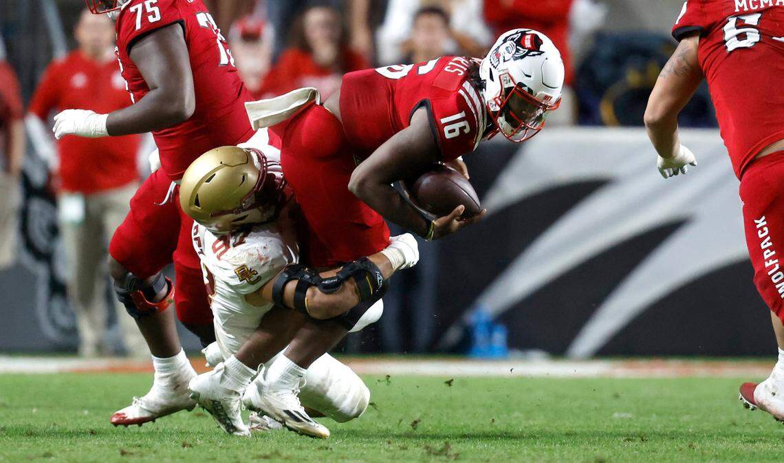 Boston College defensive end Marcus Valdez (97) sacks N.C. State quarterback MJ Morris (16) during the second half of Boston College’s 21-20 victory over N.C. State at Carter-Finley Stadium in Raleigh, N.C., Saturday, Nov. 12, 2022.