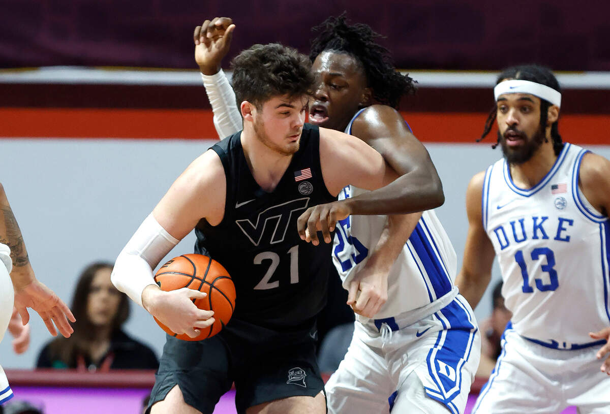 Duke’s Mark Mitchell (25) tries to defend Virginia Tech’s Grant Basile (21) during the second half of Virginia Tech’s 78-75 victory over Duke at Cassell Coliseum in Blacksburg, VA., Monday, Jan. 23, 2023.