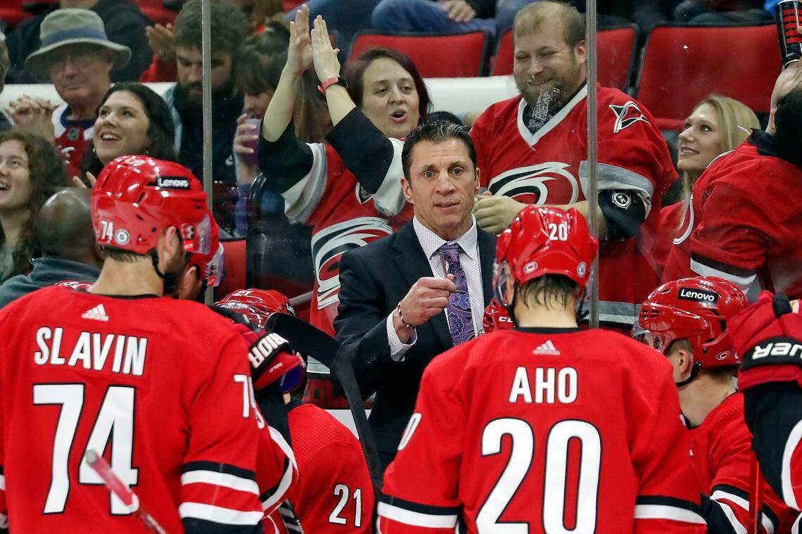 Carolina Hurricanes coach Rod Brind’Aour talks to the team during a timeout in the third period of the team’s NHL hockey game against the Montreal Canadiens in Raleigh, N.C., Thursday, March 31, 2022. (AP Photo/Karl B DeBlaker)