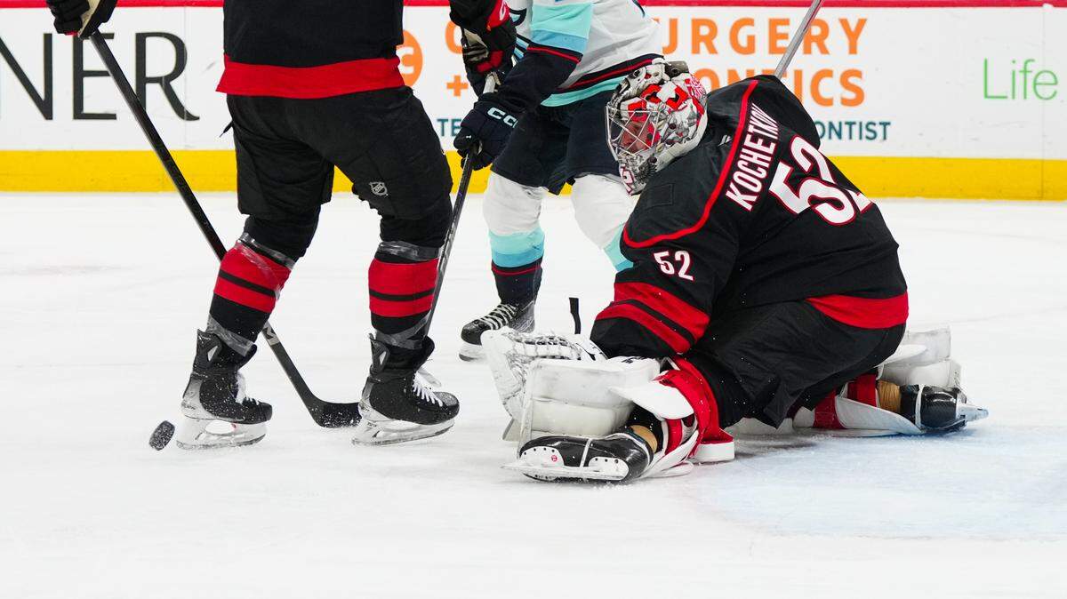 Carolina Hurricanes goaltender Pyotr Kochetkov (52) makes a save against the Seattle Kraken during the second period at Lenovo Center.