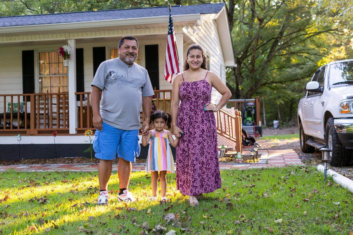 Carlos Bajana and his wife Andrea Bajana with their 4-year-old daughter Cassandra Bajana at their home in Henderson. The rate of Latino homeowners has steadily risen in the in North Carolina, with homeownership rates increasing in 95 of the state’s 100 counties over the last decade, Census data shows.