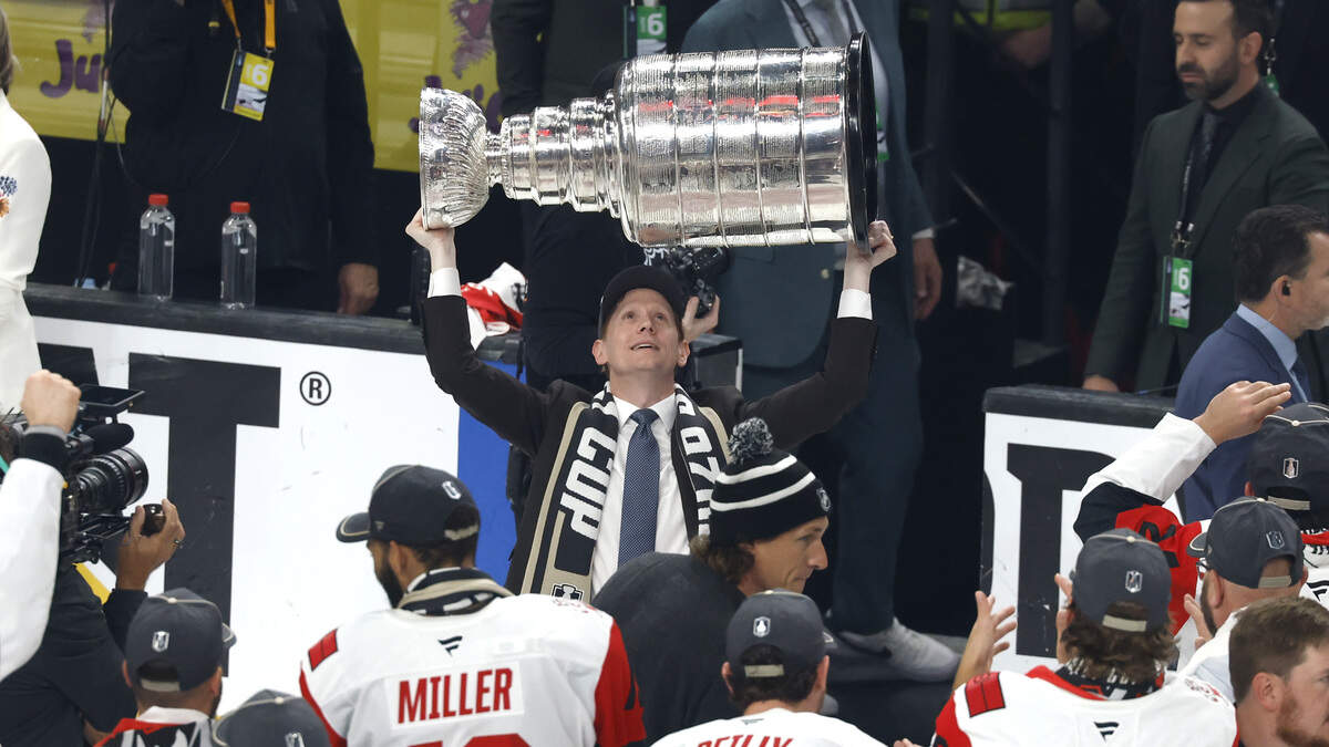 The Canes general manager Eric Tulsky raises the Cup after the Hurricanes’ 3-0 victory over the Vegas Golden Knights to win the Stanley Cup at T-Mobile Arena in Las Vegas, Nev., Sunday, June 14, 2026.