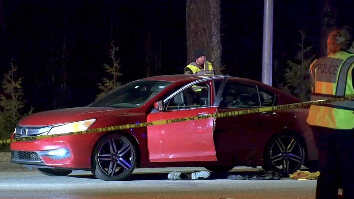 Garner police are investigating after finding a person shot inside this red sedan Monday night