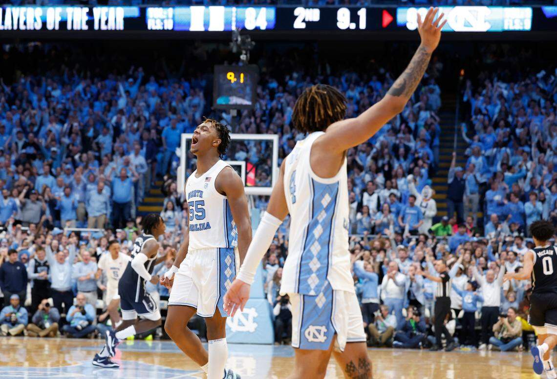 North Carolina’s Harrison Ingram (55) celebrates as RJ Davis (4) waves to the Duke crowd as time runs out in the game during UNC’s 93-84 victory over Duke at the Smith Center in Chapel Hill, N.C., Saturday, Feb. 3, 2024.