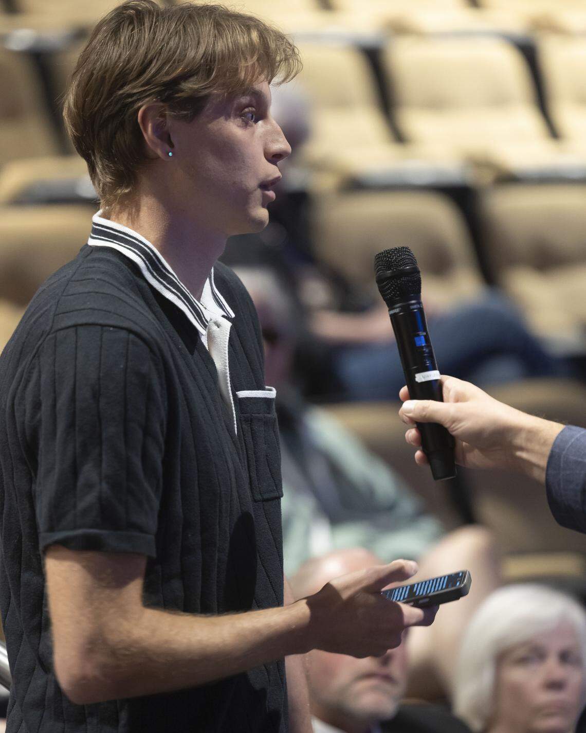 William Coffin addresses Cary Mayor Harold Weinbrecht Jr., following his State of Cary address, calling the mayor ‘cowardly’ for his response to his questions about ICE, on Thursday, March 5, 2026 at Town Hall in Cary, N.C.