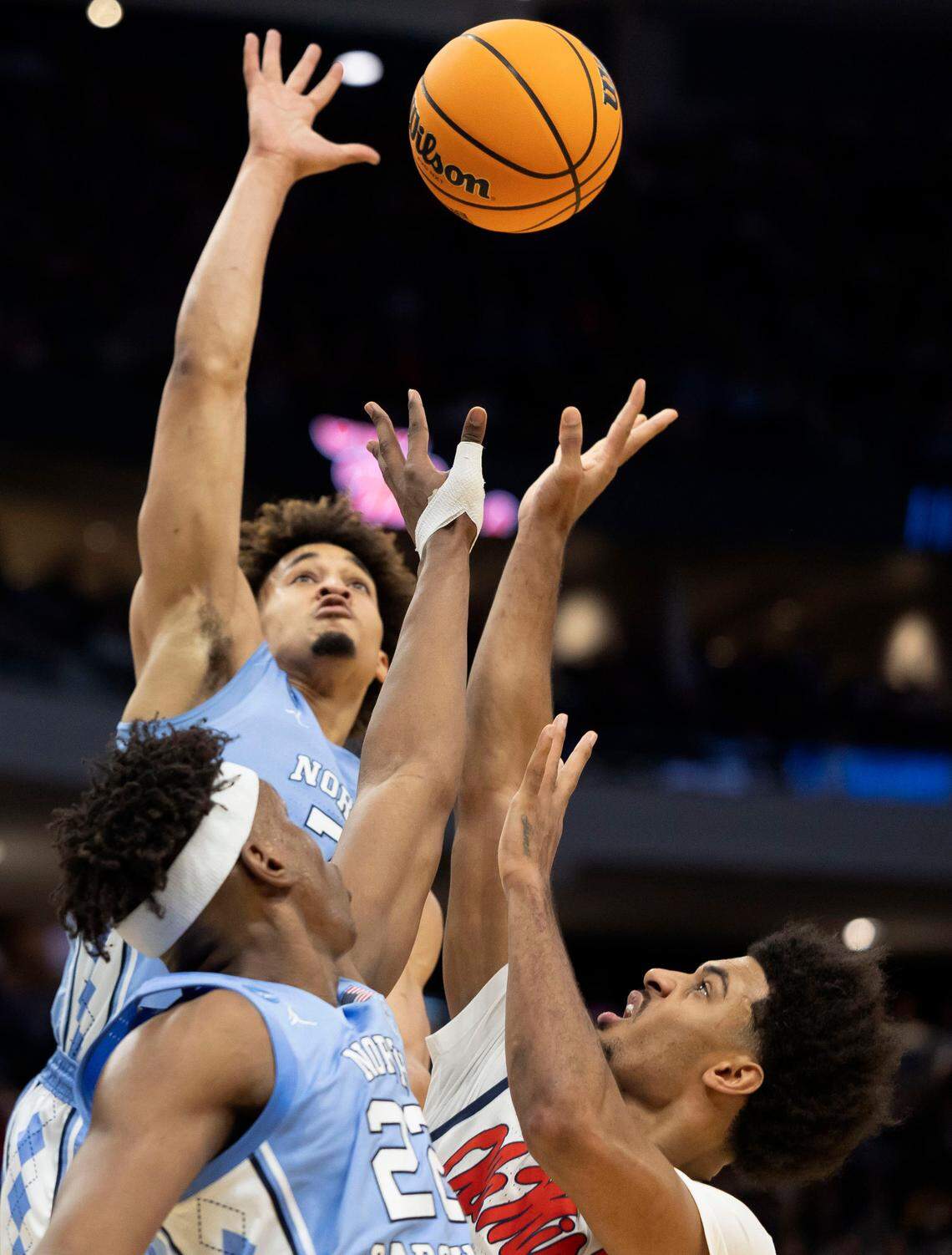 North Carolina guard Seth Trimble (7) and forward Ven-Allen Lubin (22) defend Ole Miss’ Jaemyn Brakefield (4) in the first half during the first round of the NCAA Tournament t on Friday, March 21, 2025 at Fiserv Forum in Milwaukee, Wisconsin.