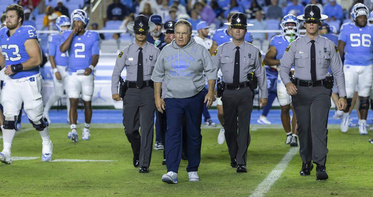 North Carolina coach Bill Belichick walks to mid-field to congratulate Texas Christian University head coach Sonny Dykes following the Horned Frogs’ 48-14 victory on Monday, September 1, 2025 at Kenan Stadium in Chapel Hill, N.C. 