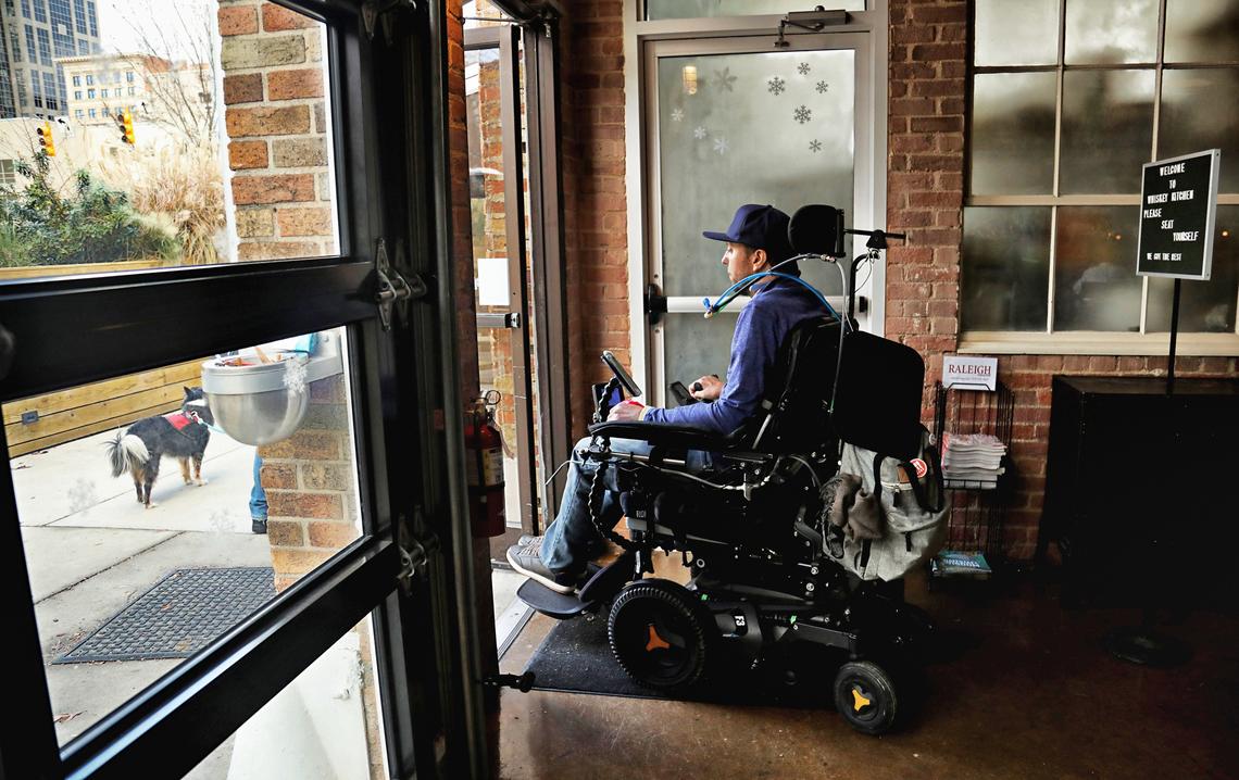 “I will walk through these doors,” says Michael Thor, a co-owner of Whiskey Kitchen, on Dec. 21, 2019. Thor is learning to manage in a new way after a motorcycle accident four years ago left him with an injury to his spinal cord.