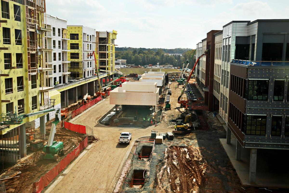 A look down Main Street under construction at the mixed-use development, Fenton, in Cary on Tuesday, Nov. 2, 2021. The development located off of Cary Towne Blvd will include apartments, shopping, dining, a hotel and workspaces.