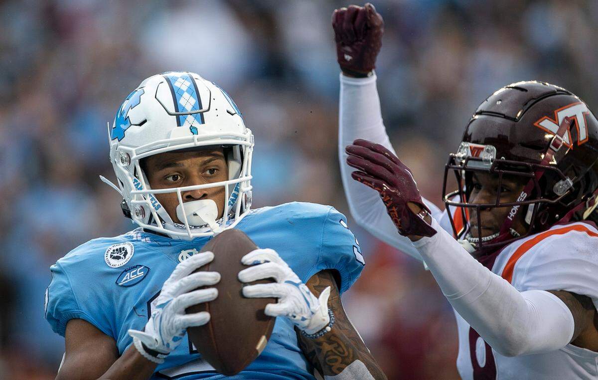 North Carolina’s Antonie Green (3) pulls in a 16-yard reception from quarterback Drake Maye (10) for a touchdown to give the Tar Heels’ a 21-3 lead over Virginia Tech on Saturday, October 1, 2022 at Kenan Stadium in Chapel Hill, N.C.