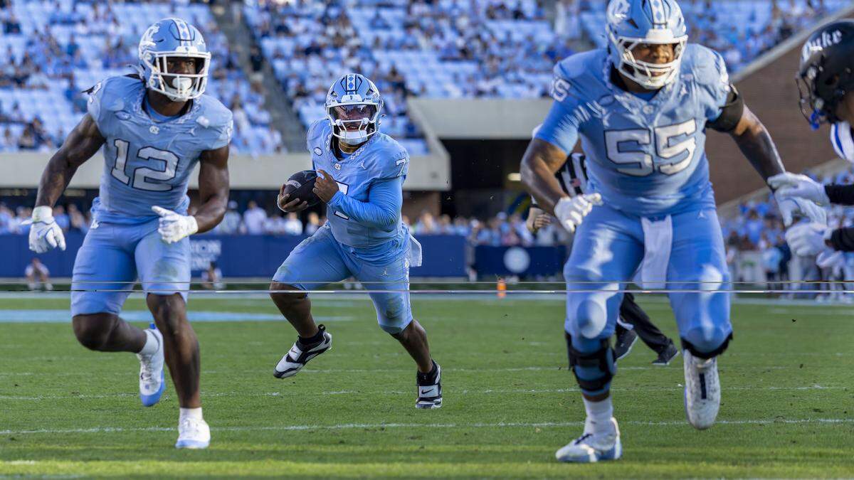 North Carolina quarterback Gio Lopez (7) scores a touchdown on a one yard run to take a 7-0 lead against Duke in the first quarter on Saturday, November 22, 2025 at Kenan Stadium in Chapel Hill, N.C.