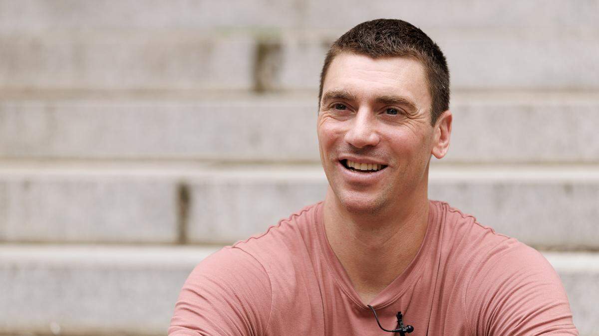 Former North Carolina basketball player Tyler Hansbrough smiles while speaking with media on Tuesday, Aug. 19, 2025, outside the UNC Hussman School of Journalism and Media in Chapel Hill, N.C. 