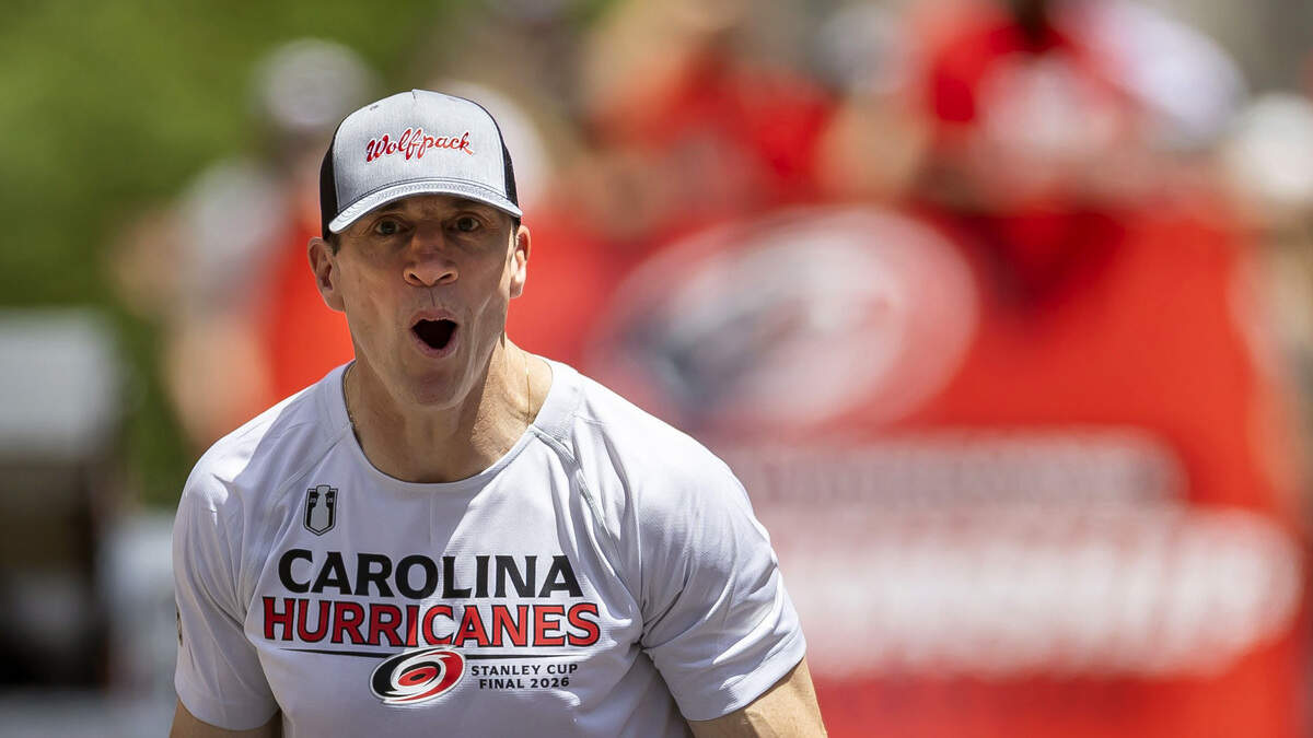 Carolina Hurricanes head coach Rod Brind’Amour acknowledges fans as he rides down Fayetteville Street during a parade for the Stanley Cup Champions on Saturday, June 20, 2026 in Raleigh, NC.