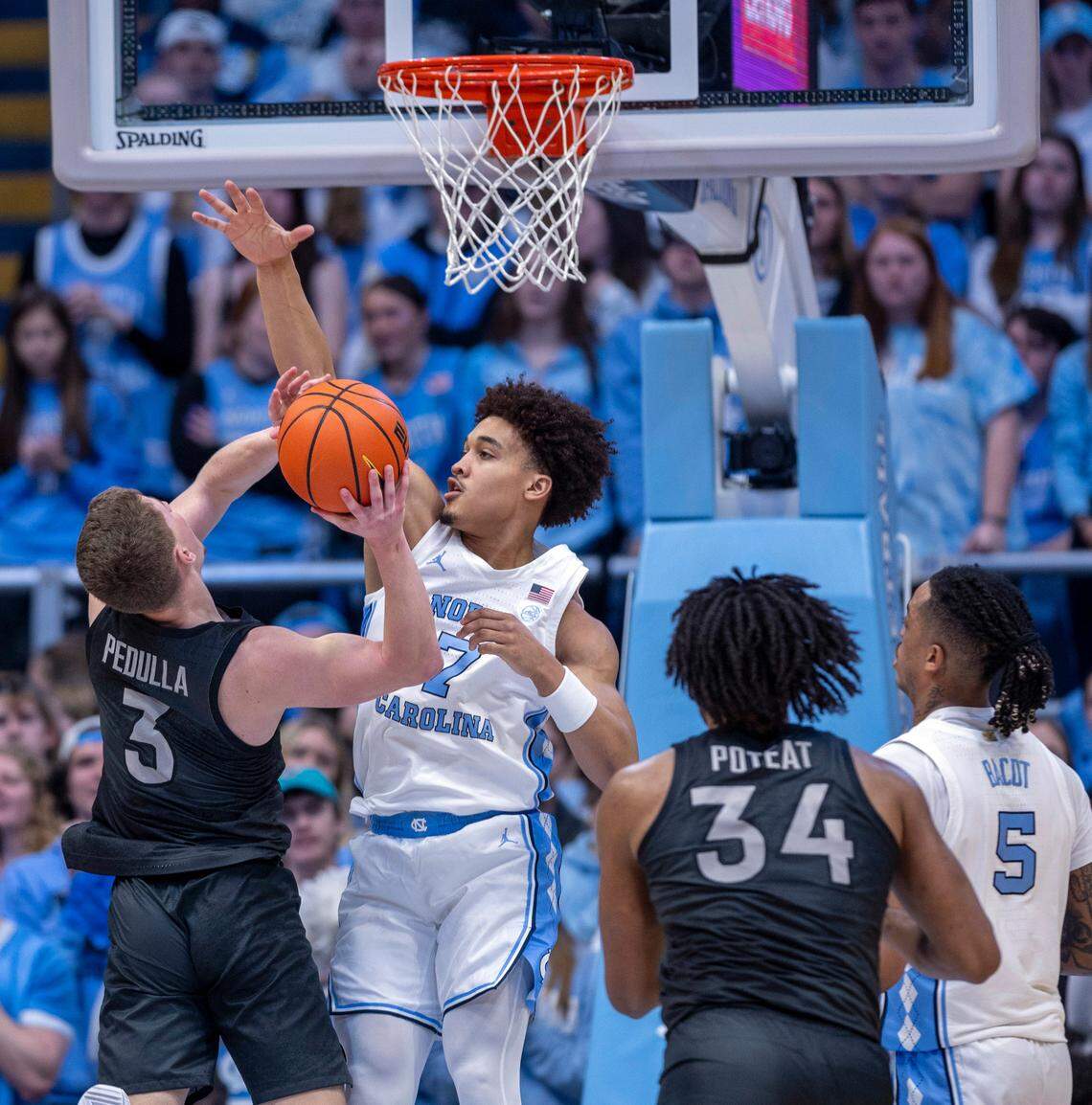 North Carolina’s Seth Trimble (7) defends Virginia Tech’s Sean Pedulla (3) during the first half on Saturday, February 17, 2023 at the Smith Center in Chapel Hill, N.C.