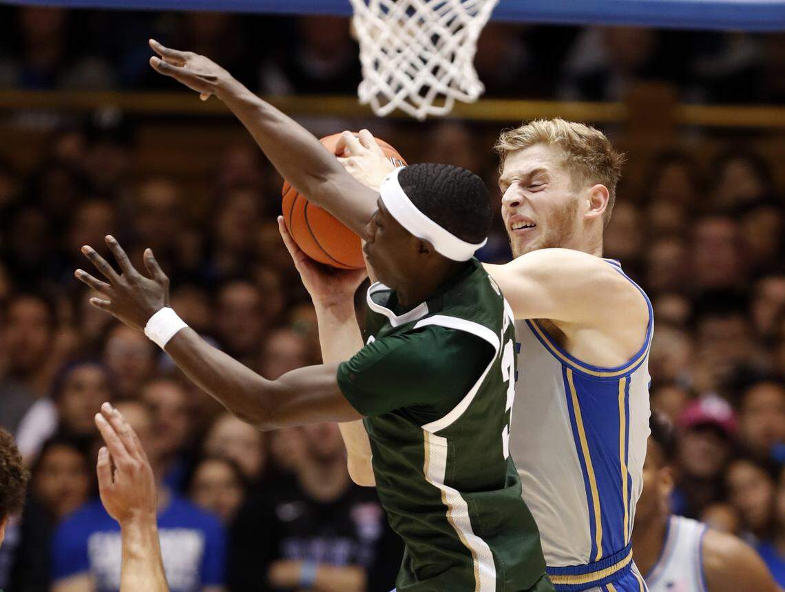 Duke’s Jack White (41) pulls in a rebound battling Colorado State’s Kendle Moore (3) during the first half of Duke’s game against Colorado State at Cameron Indoor Stadium in Durham, N.C., Friday, Nov. 8, 2019.