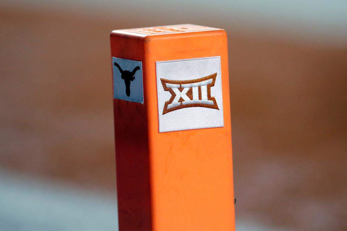 The Big 12 conference logo is seen on a pylon during the first half of an NCAA college football game between Texas and USC in Austin, Texas. Texas and Oklahoma made a request Tuesday, July 27, 2021, to join the Southeastern Conference — in 2025 —- with SEC Commissioner Greg Sankey saying the league would consider it in the “near future.”