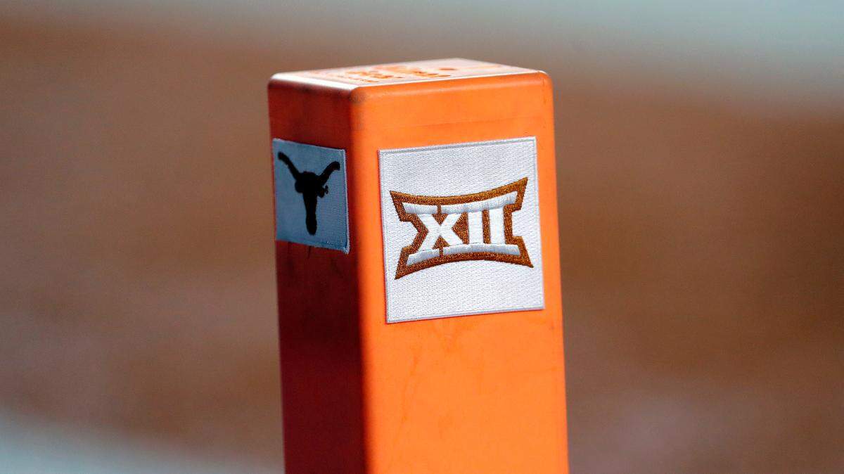 The Big 12 conference logo is seen on a pylon during the first half of an NCAA college football game between Texas and USC in Austin, Texas. Texas and Oklahoma made a request Tuesday, July 27, 2021, to join the Southeastern Conference — in 2025 —- with SEC Commissioner Greg Sankey saying the league would consider it in the “near future.”