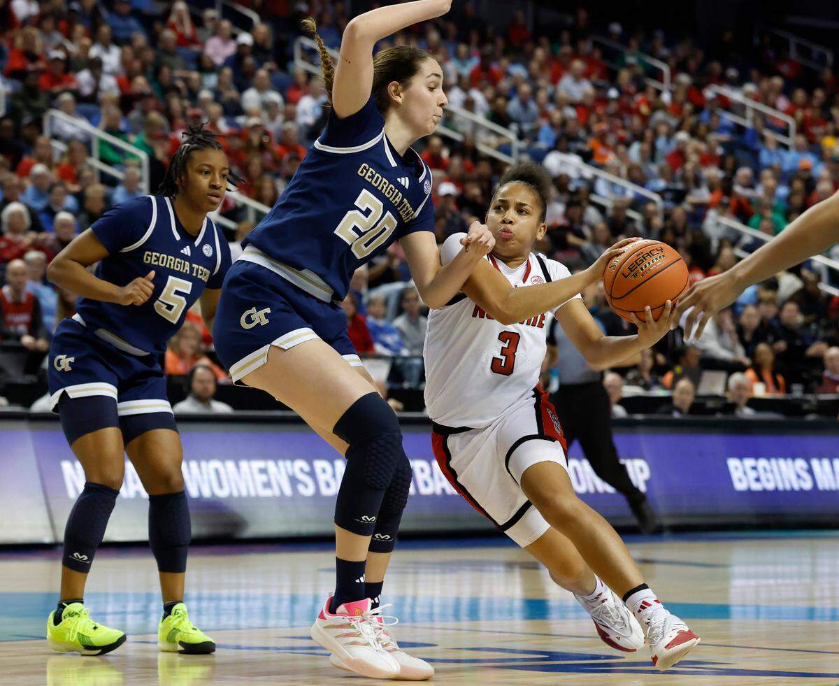 N.C. State’s Zamareya Jones drives past Georgia Tech’s Ariadna Termis during the first half of the Wolfpack’s ACC Tournament quarterfinal game on Friday, March 7, 2025, at First Horizon Coliseum in Greensboro, N.C.