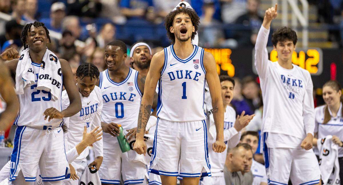 Duke’s Dereck Lively II (1) and the Blue Devils’ bench react after a three point basket by reserve player Christian Reeves (21) to take a 92-56 lead over Pittsburgh in the second half during the third round of the ACC Tournament on Thursday, March 9, 2023 at the Greensboro Coliseum in Greensboro, N.C.