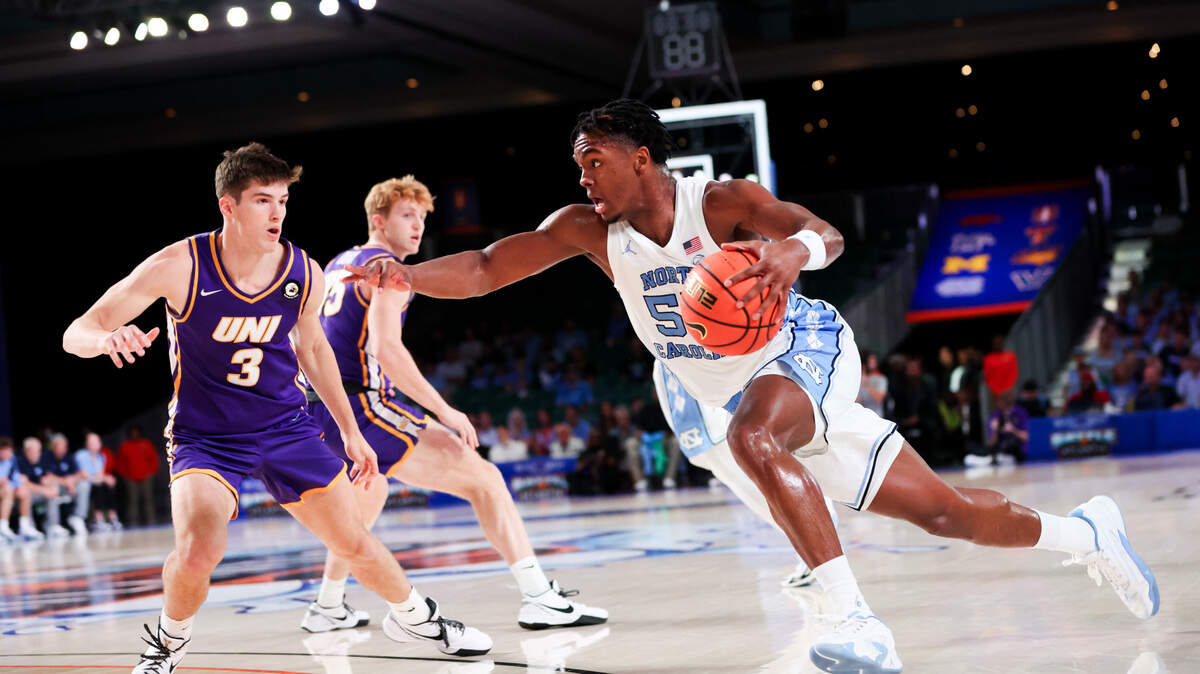 Nov 22, 2023; Paradise Island, BAHAMAS; North Carolina Tar Heels forward Harrison Ingram (55) drives to the basket as Northern Iowa Panthers guard Landon Wolf (3) defends during the first half at Imperial Arena. Mandatory Credit: Kevin Jairaj-USA TODAY Sports