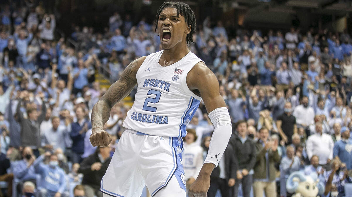 North Carolina’s Caleb Love (2) reacts after a dunk to give the Tar Heels’ an early lead over Michigan during the first half on Wednesday, December 1, 2021 at the Smith Center in Chapel Hill, N.C.