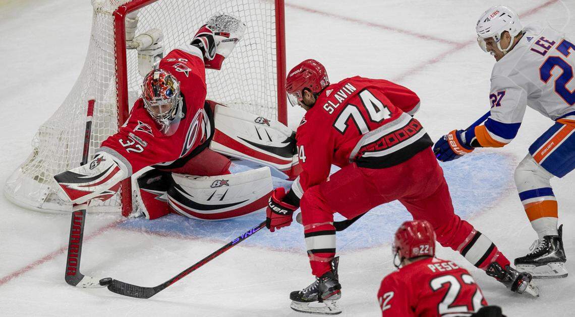 Carolina Hurricanes goalie Antii Raanta (32) stops a scoring attempt by New York Islanders’ Anders Lee (27) in the second period on Monday, April 17, 2023 at PNC Arena in Raleigh, N.C.