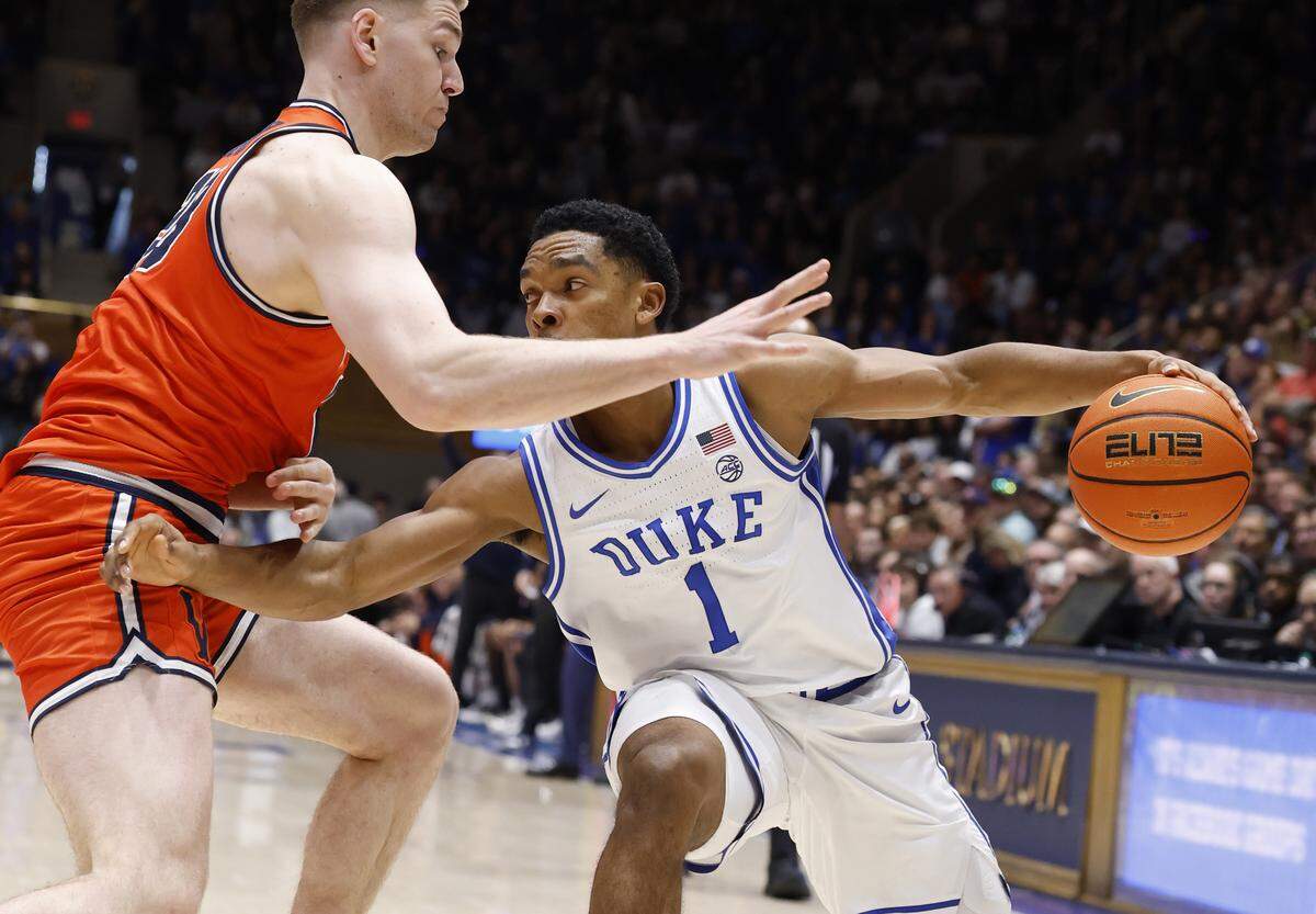 Duke’s Caleb Foster (1) looks to drive around Virginia's Thijs de Ridder (28) during the second half of Duke’s 77-51 victory over Virginia at Cameron Indoor Stadium in Durham, N.C., Saturday, Feb. 28, 2026.