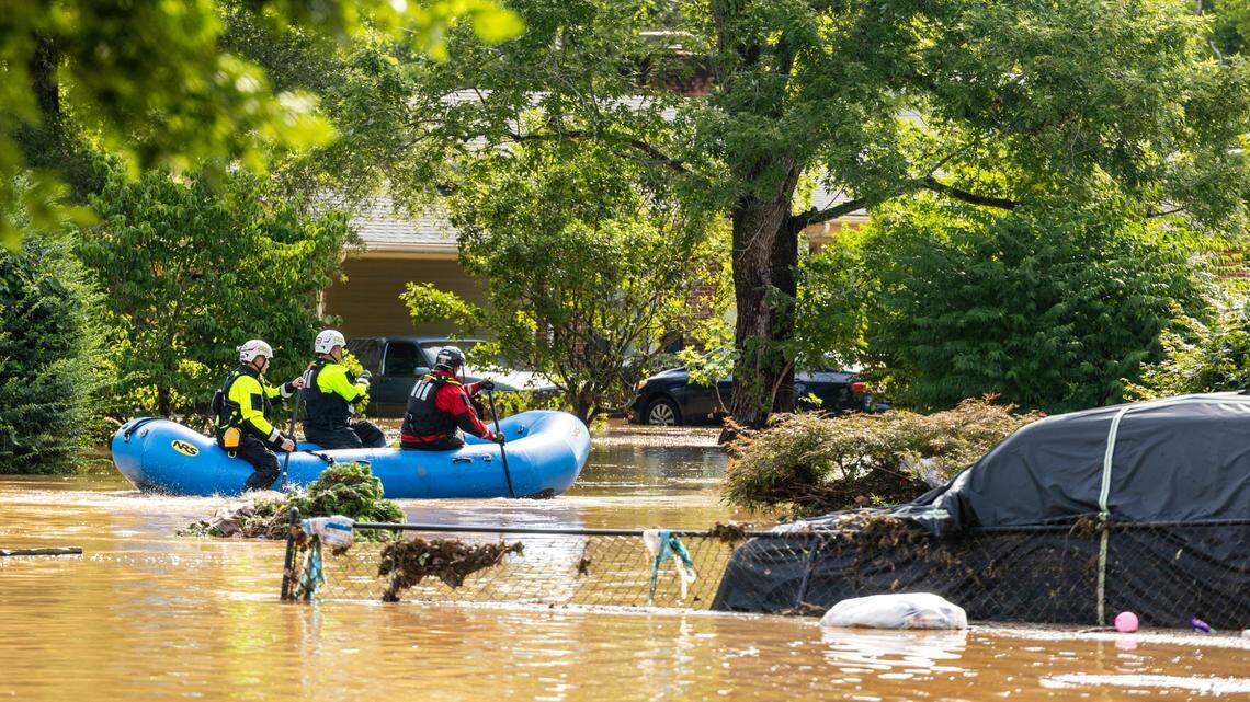 A water rescue unit paddles a raft in the Old Farm neighborhood along the Eno River in Durham on Monday morning, July 7, 2025, after Tropical Storm Chantal caused flash flooding.