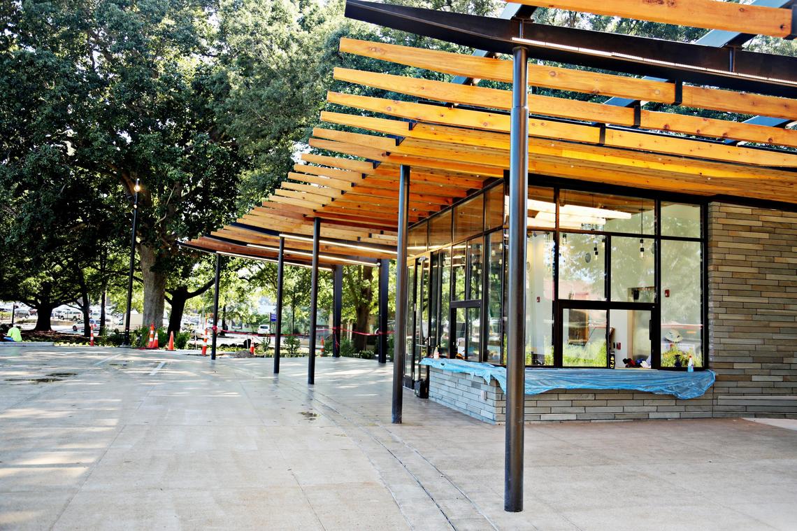 Moore Square’s cafe is clad, brick-like, in bluestone slate, and framed with blackened steel and reclaimed cedar.
