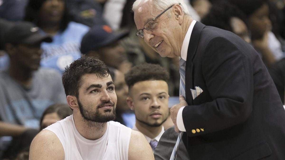 UNC basketball coach Roy Williams, right, will next season have a roster that includes senior Luke Maye, left.